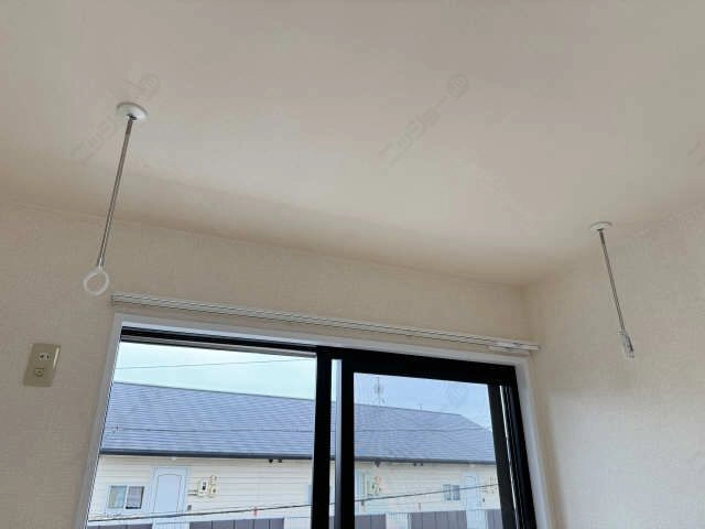 室内物干し竿かけ